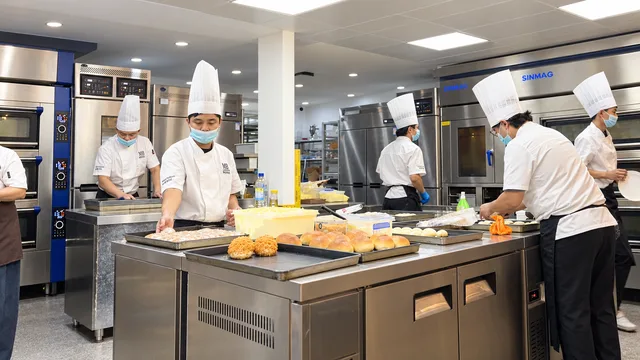 Maison Berrie bakers preparing bread at the workbench